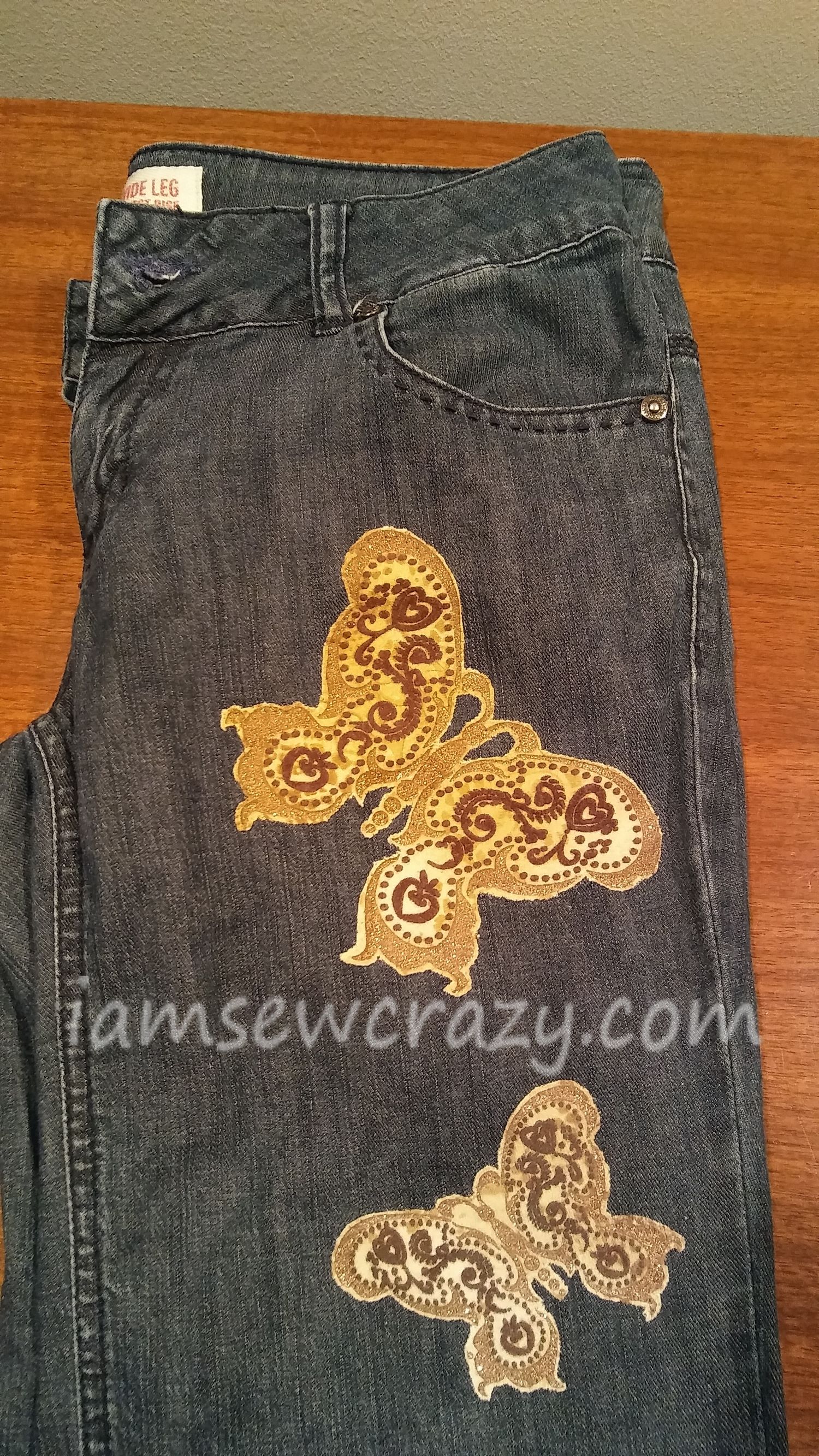 sewing patches on jeans