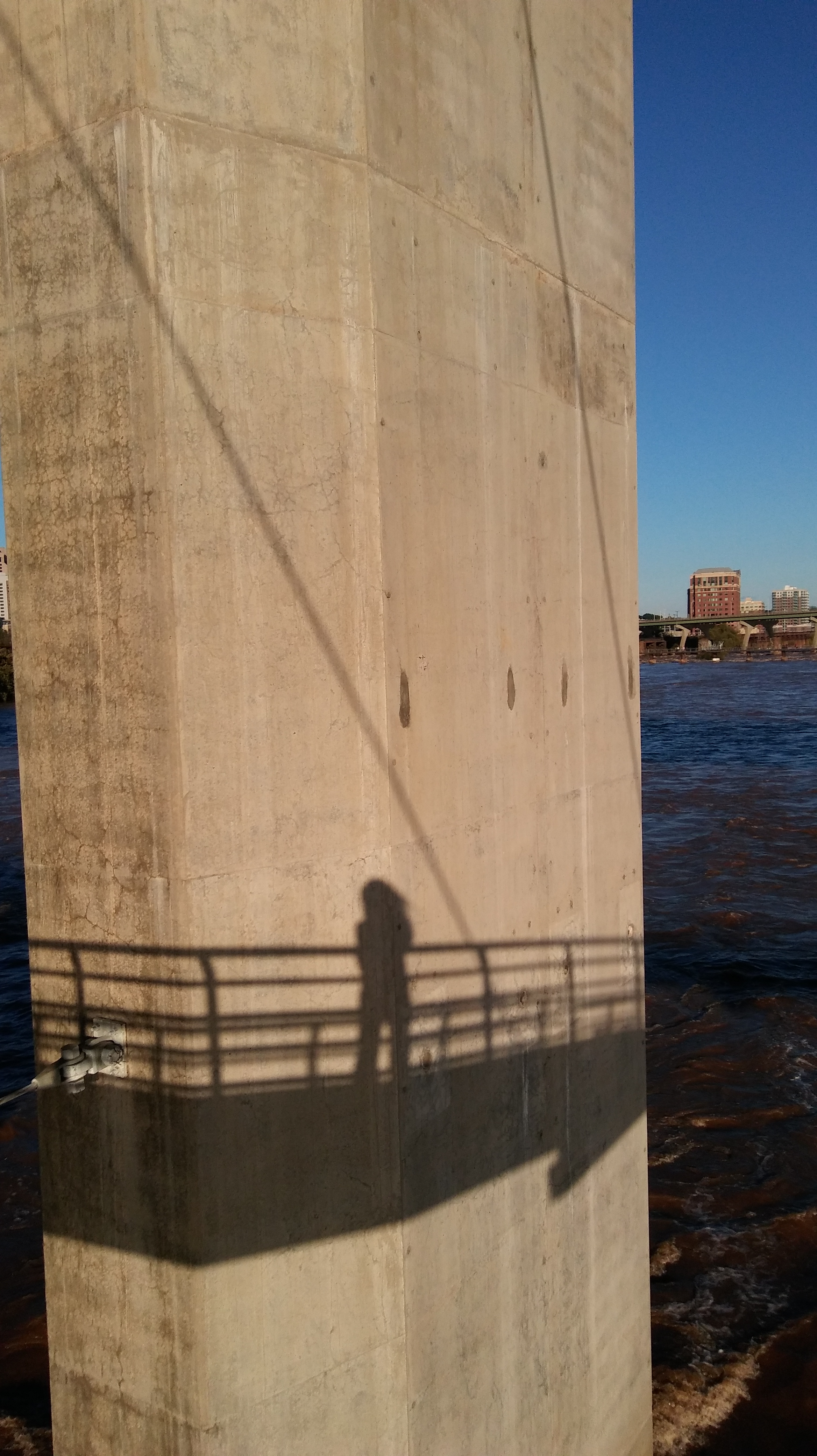 my shadow on a bridge pier