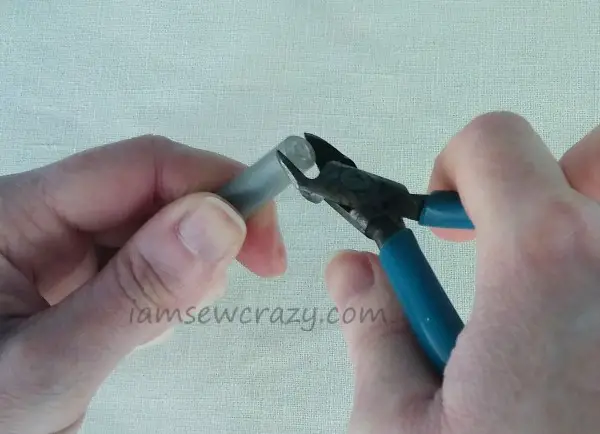 cutting the end off a pen cap