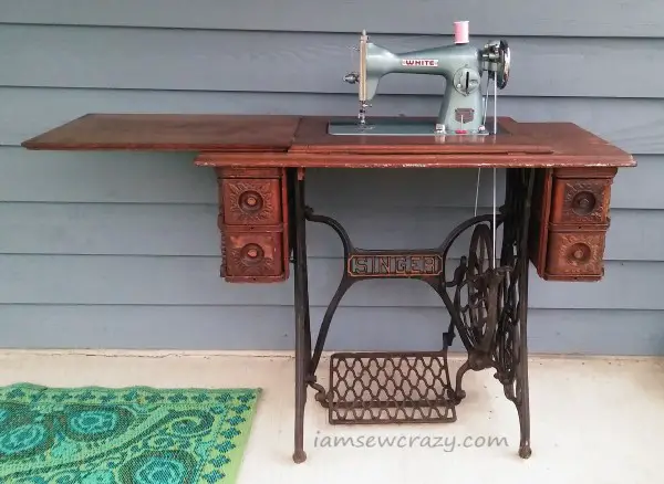 vintage sewing machine in treadle table