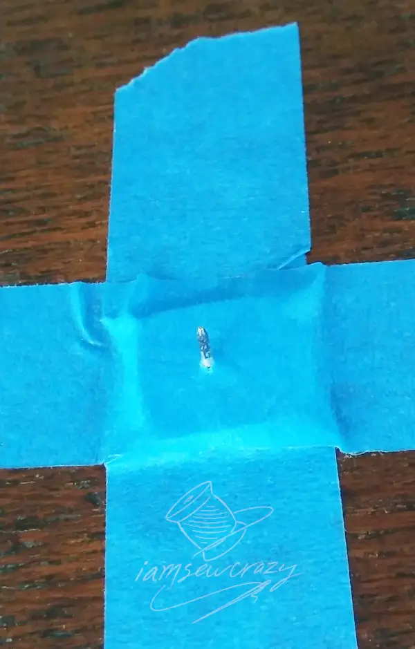 thumbtack taped to table