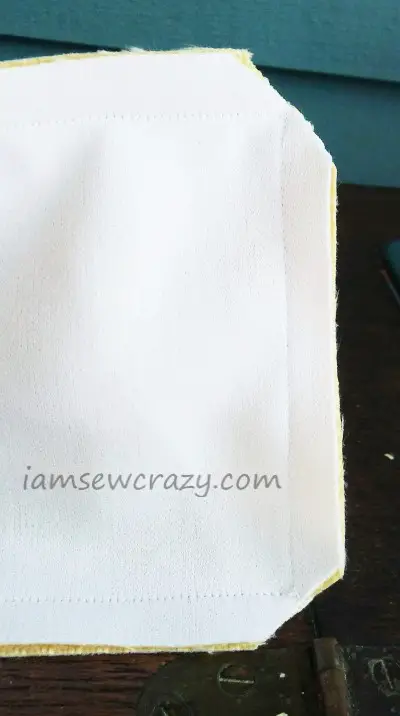 trimming the corners of the sewn pillow