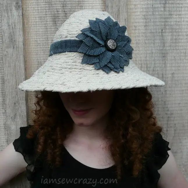 tan sun hat with blue flower