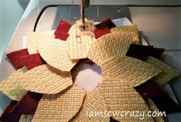 sewing a line on top of fabric flower petals