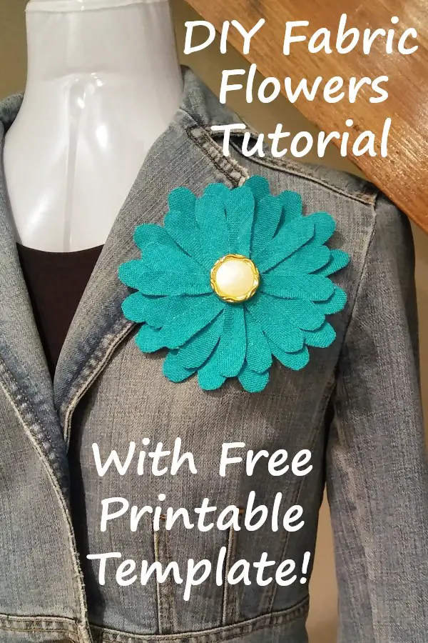 teal fabric daisy attached to a denim jacket with text overlay: d i y fabric flowers tutorial with free printable template