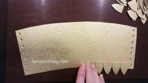 gluing gold dragon scales to arm cuff
