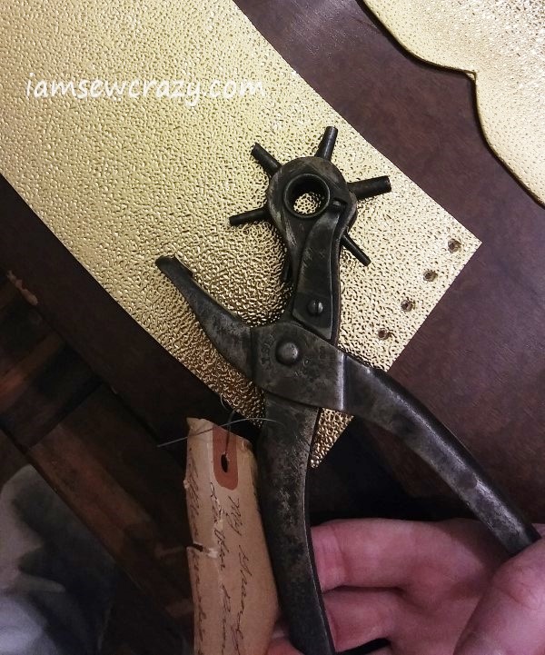 punching holes to lace-up arm cuff