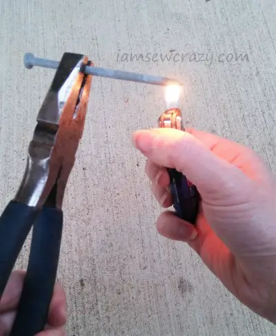 heating a nail with a flame