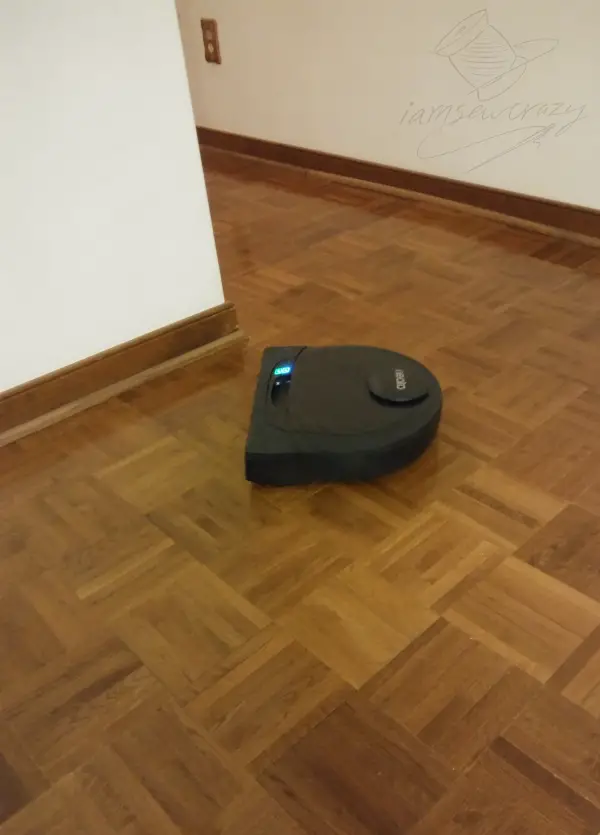 robot vacuum on parquet floor