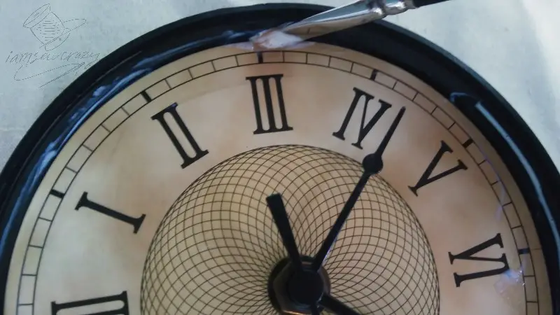 gluing edges of paper to clock face