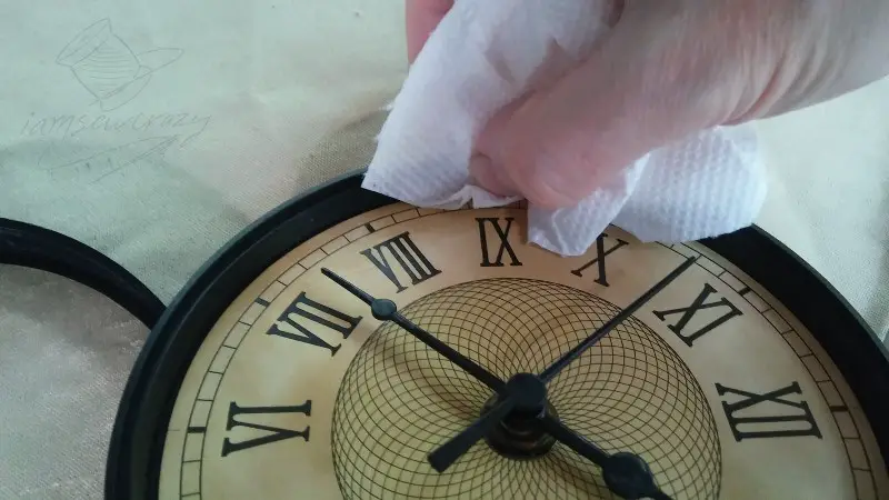 wiping excess glue off clock face