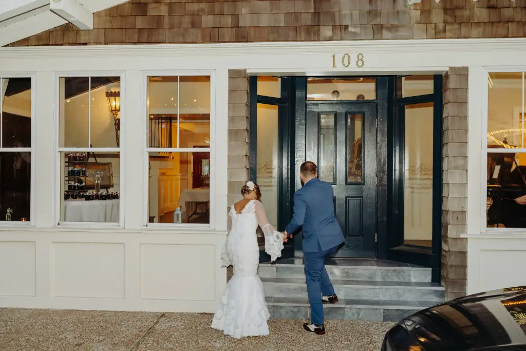 bride and groom entering reception hall