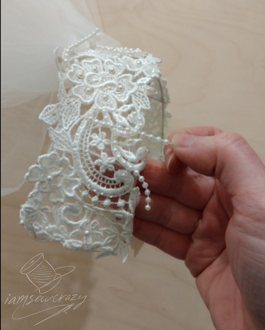 deconstructing a wedding veil by removing faux pearls