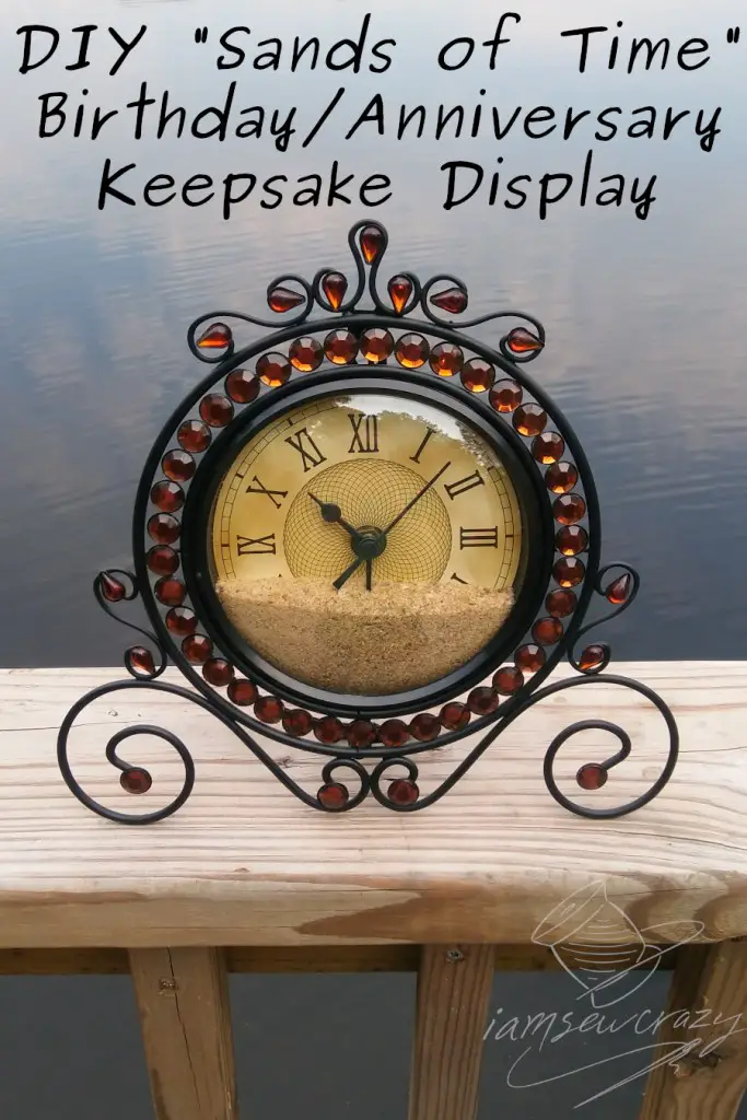 sand-filled clock sitting on dock with text overlay: DIY "sands of time" clock birthday/anniversary keepsake display
