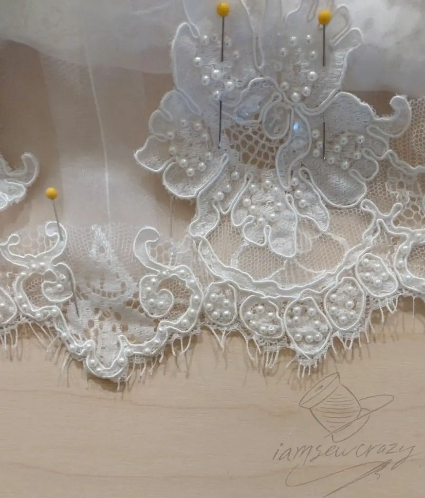 adding pearls and lace to wedding dress bell sleeves
