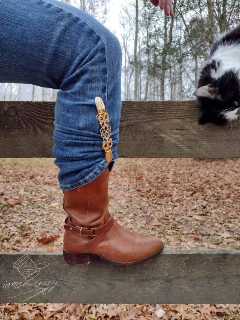 boot resting on fence rail