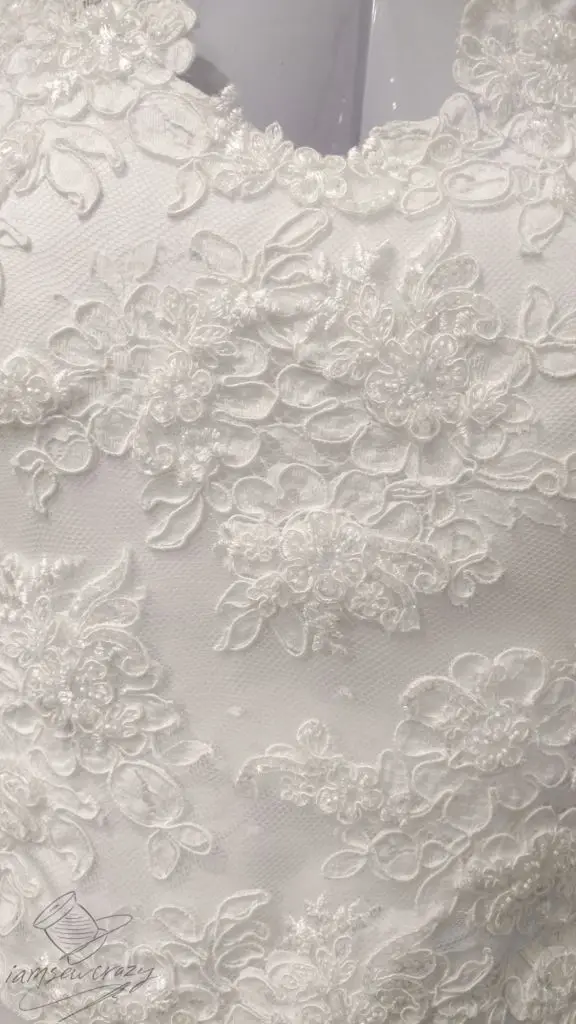 restyling a wedding dress by adding lace appliques