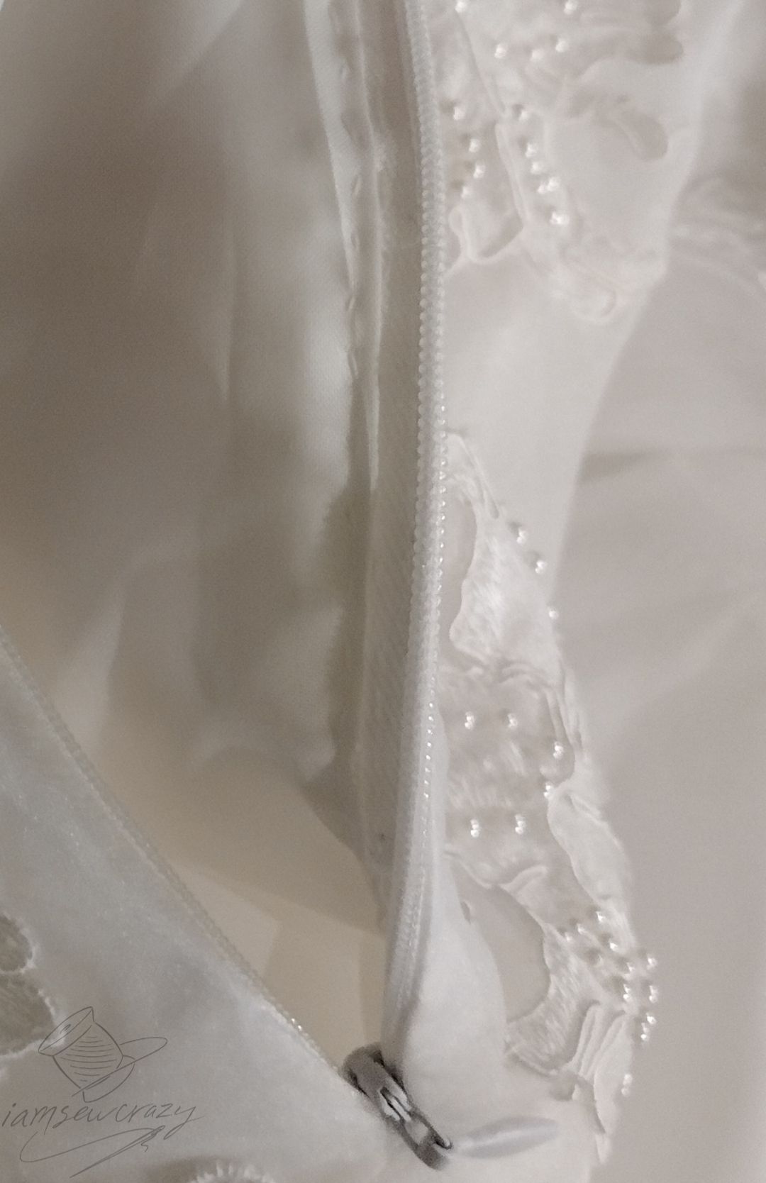 wedding dress lining hand-tacked to zipper tape