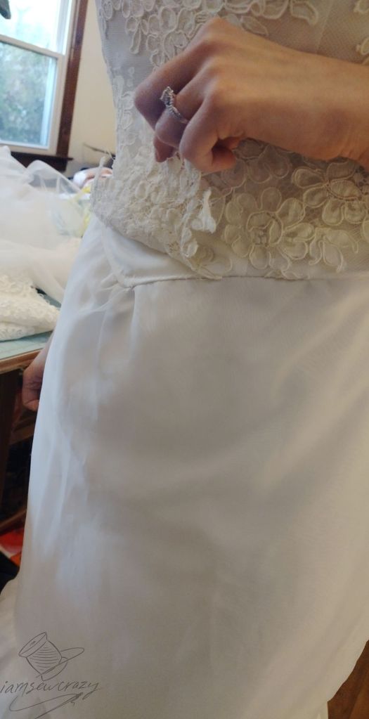 closeup of wedding dress in the process of being restyled