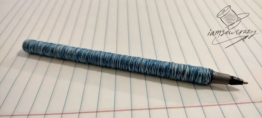 sewing thread wrapped around a ballpoint pen