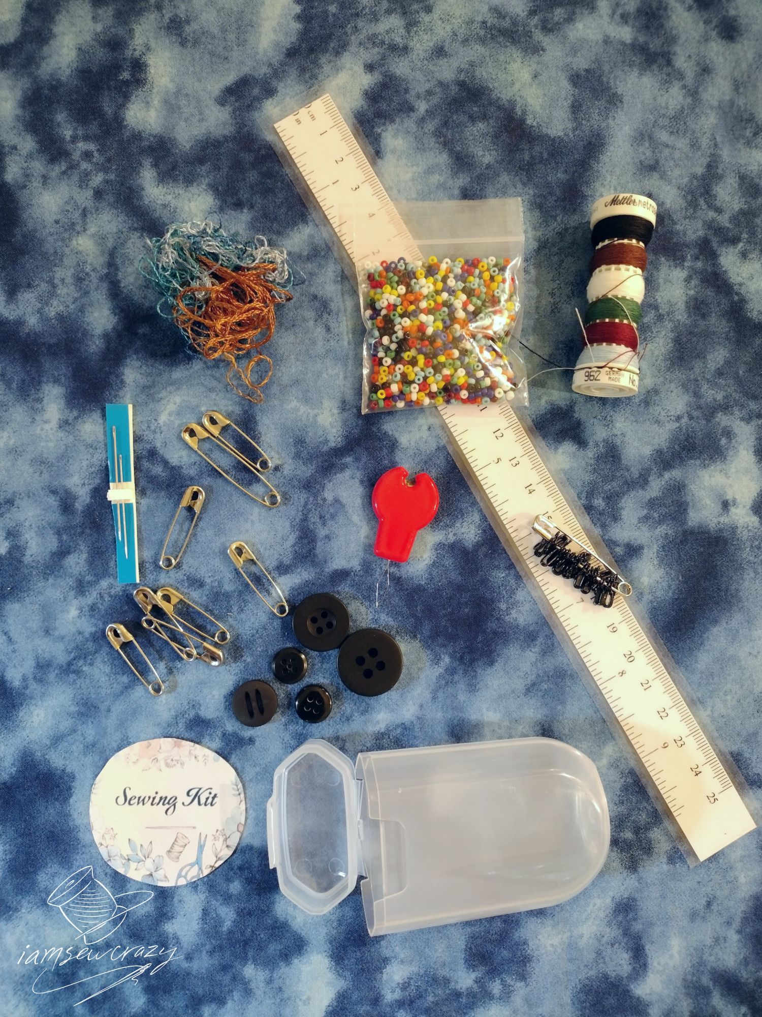 contents of tiny sewing kit that fits into a gum container