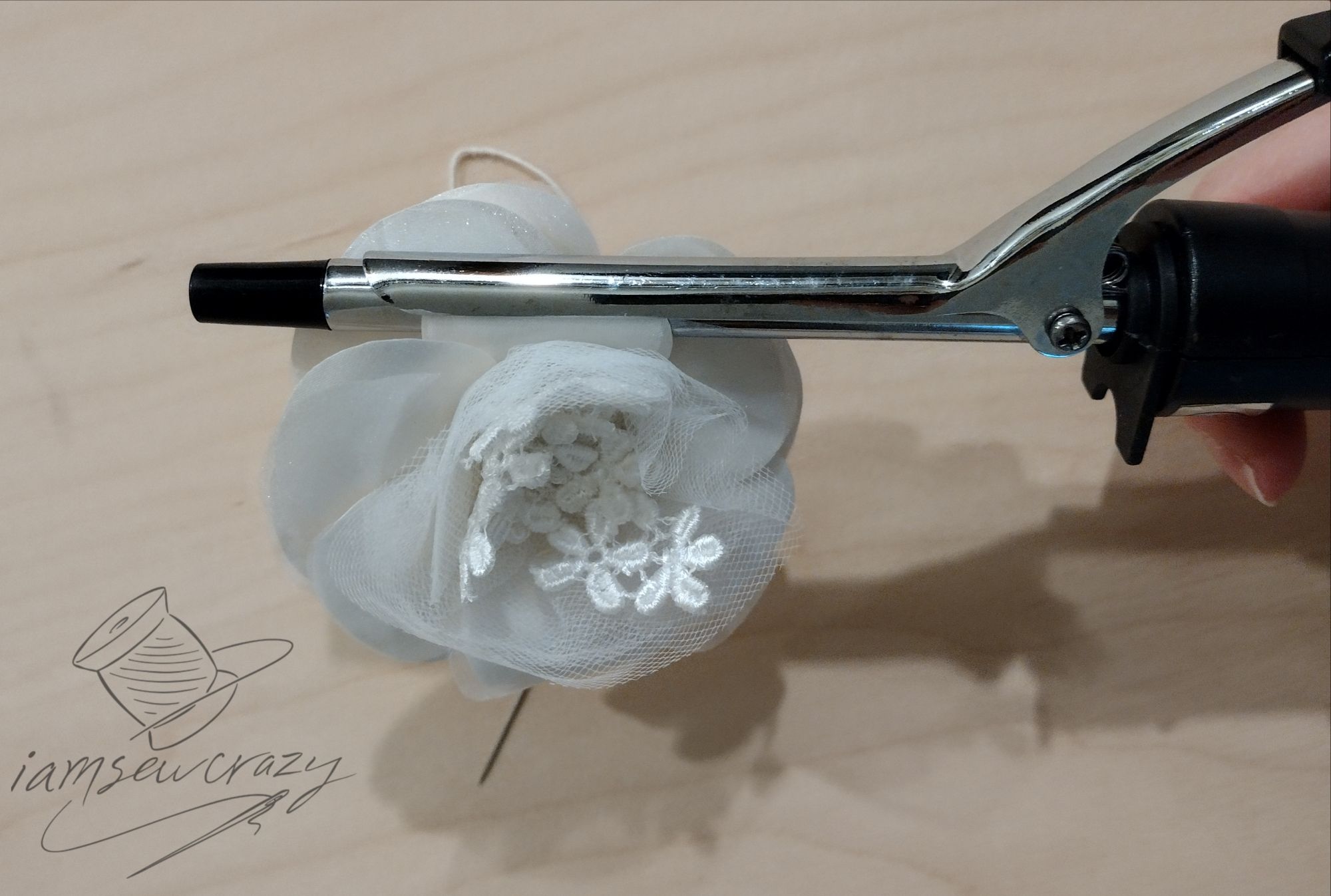 shaping a wedding fascinator with a curling iron