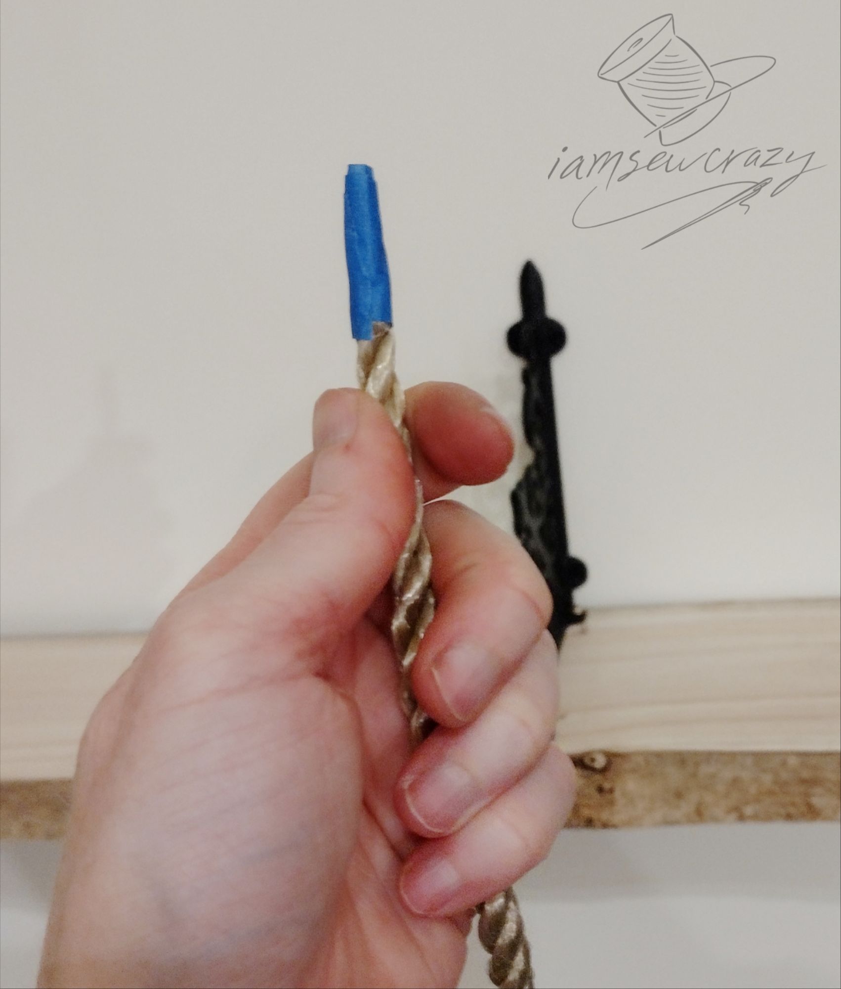 painter's tape on the end of a rope to make an aglet