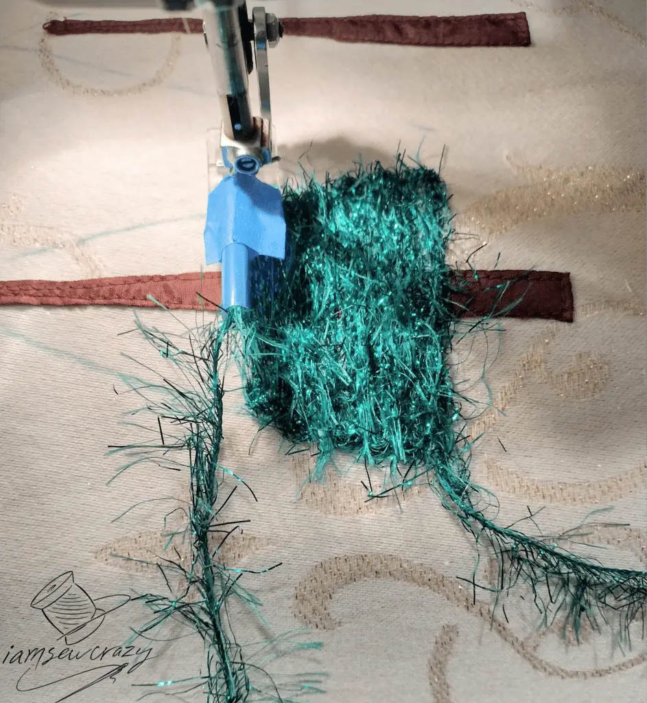 couching over eyelash yarn to create tree branches